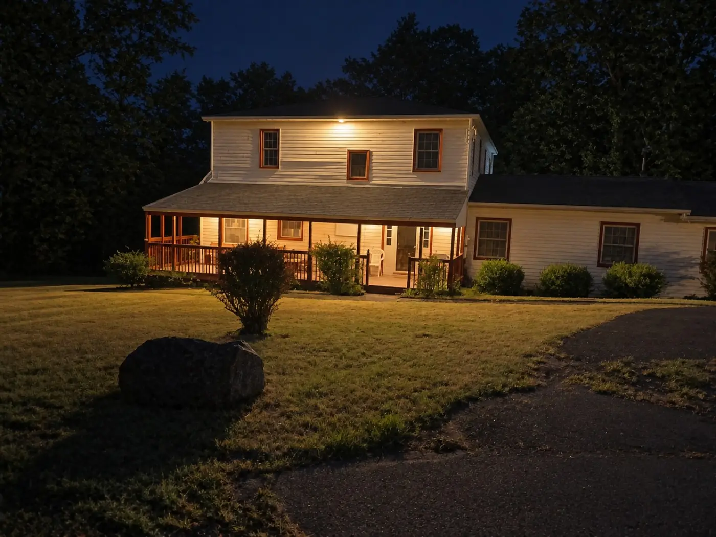 Temporary staged exterior evening view of the furnished home