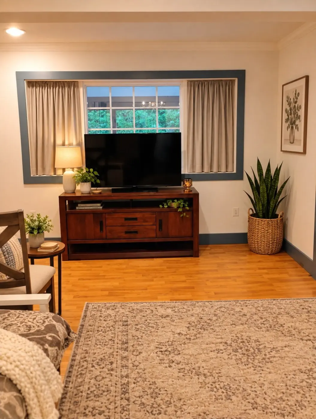 Temporary staged living room view with TV and rug